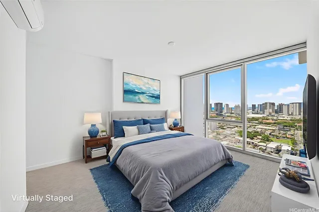 a bedroom with a large bed and a window