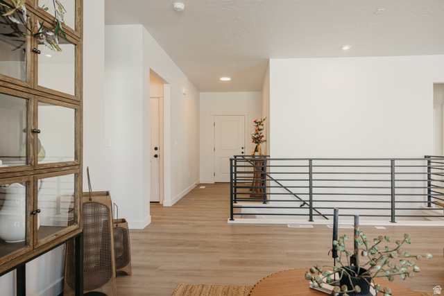4595 North Fallow Way, Unit 511 Eagle Mountain, UT 84005 - Photo 19 of 32 Corridor featuring light wood-style floors and recessed lighting