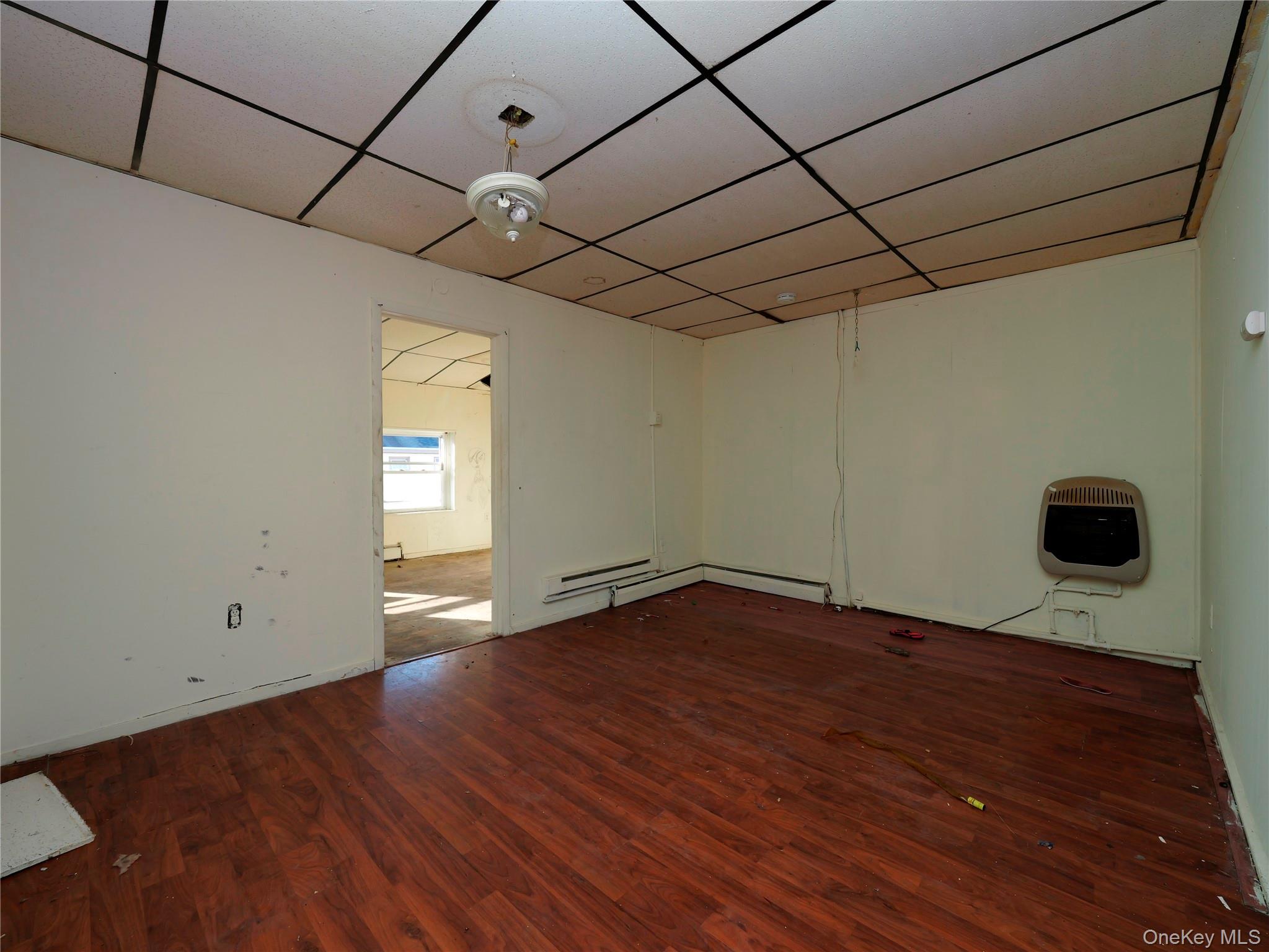 170 Chambers Street Newburgh, NY 12550 - Photo 16 of 49 a view of an empty room with a window and wooden floor