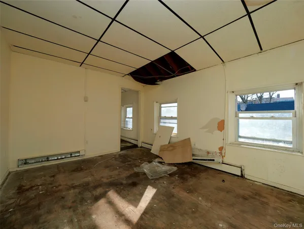 a living room with a couch and a window