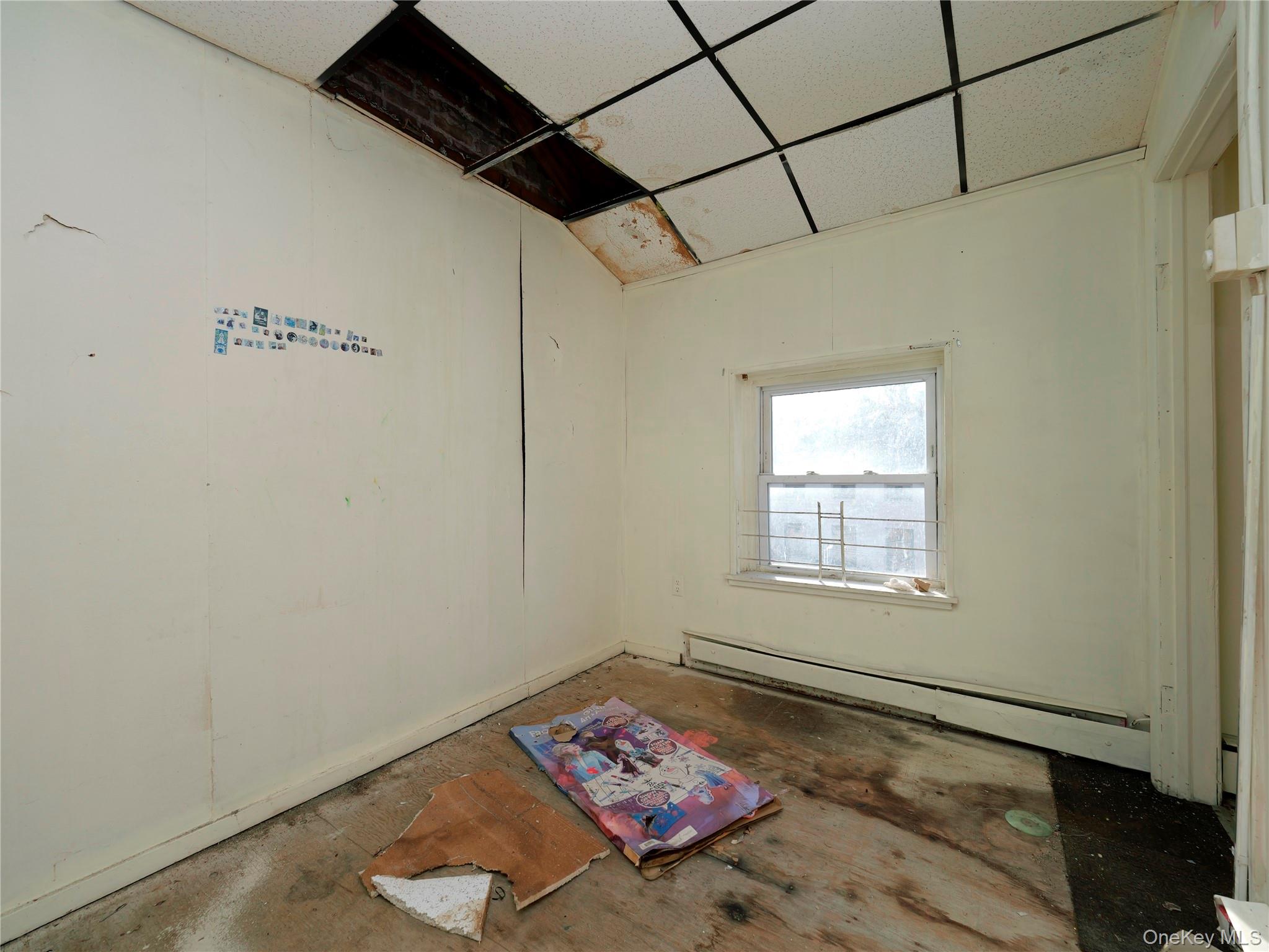 170 Chambers Street Newburgh, NY 12550 - Photo 26 of 49 a bed sitting in a bedroom next to a window