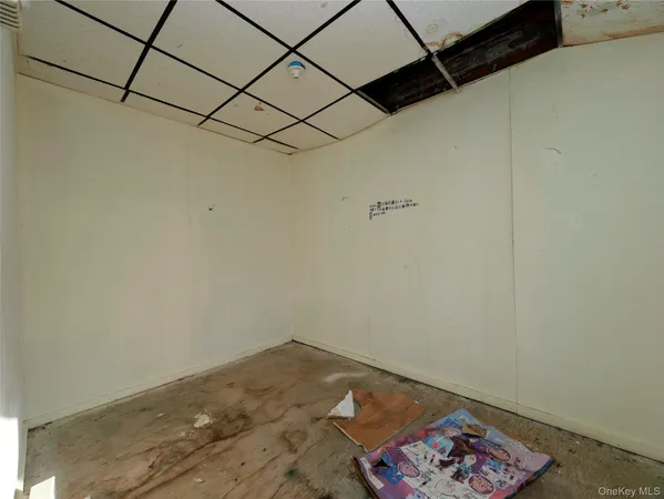 a room with a rug and a wall painting