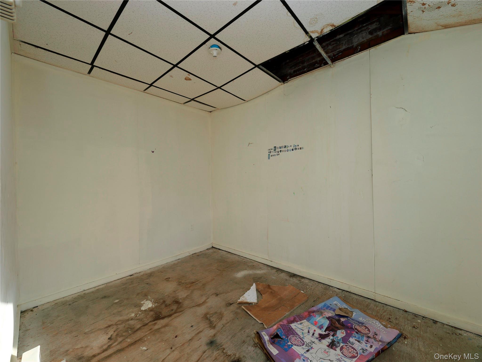 170 Chambers Street Newburgh, NY 12550 - Photo 27 of 49 a room with a rug and a wall painting