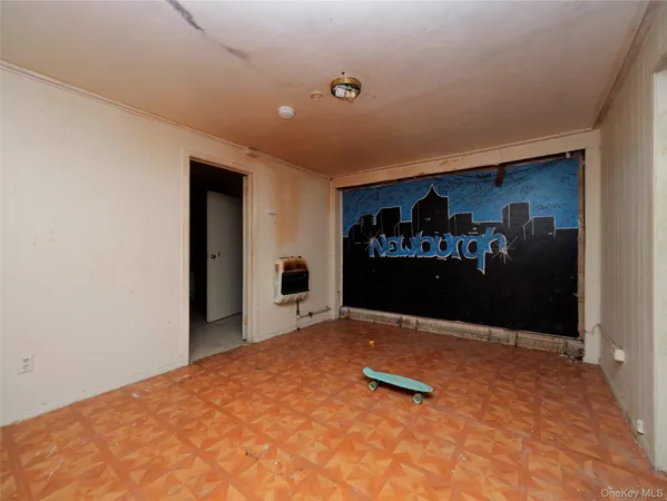 a view of room with painting on the wall