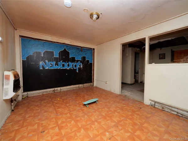 a view of a livingroom with storage & utility room