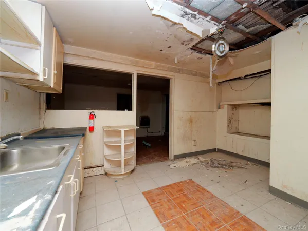 a utility room with a sink dryer and washer