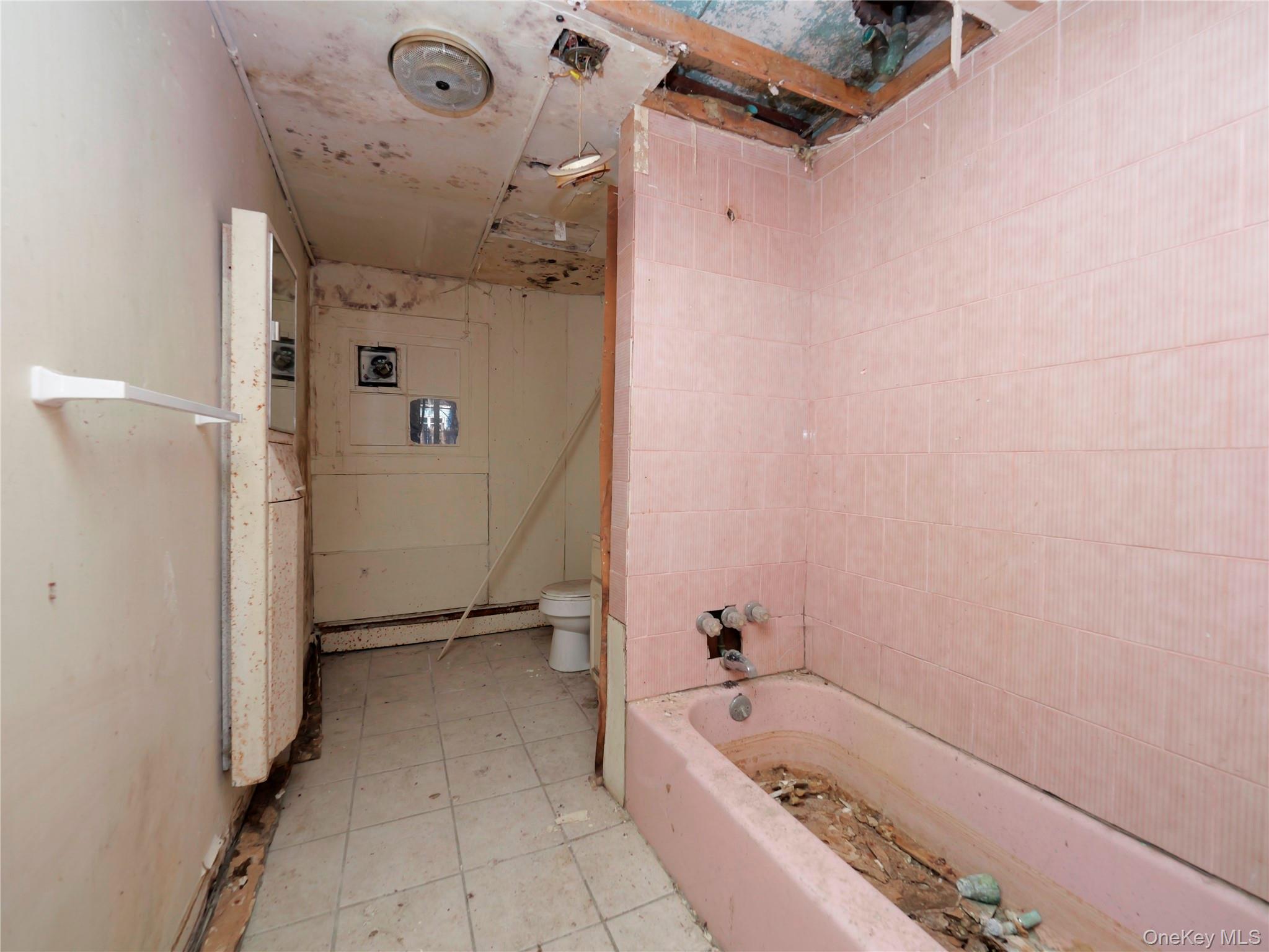 170 Chambers Street Newburgh, NY 12550 - Photo 46 of 49 a bathroom with a tub a sink and a shower