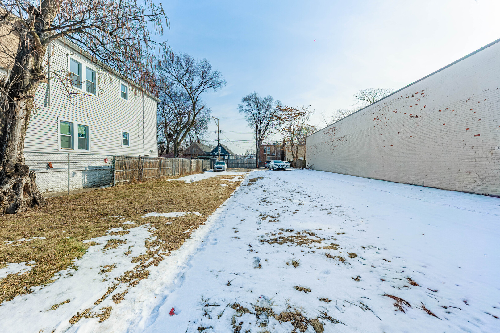a view of a backyard of the house