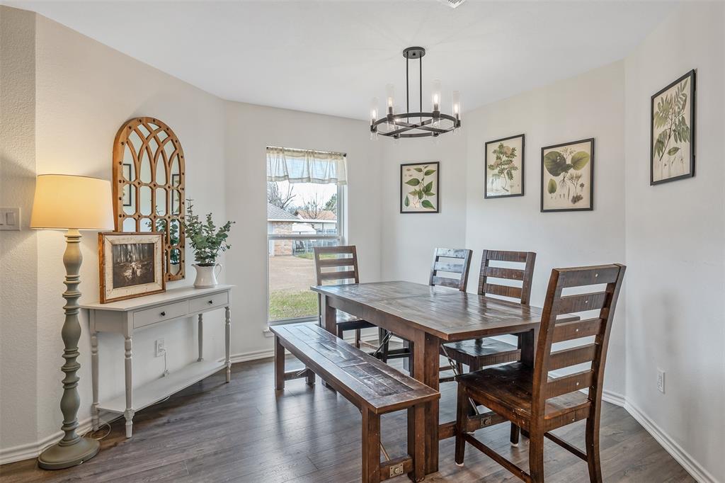300 Rash Lane Terrell, TX 75160 - Photo 6 of 28 a view of a dining room with furniture window and wooden floor