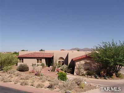 12222 Cloud Ridge Drive Tucson, AZ 85755 - Photo 1 of 10 a view of a house with a yard