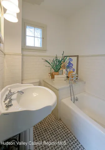 a bathroom with a bathtub and a sink