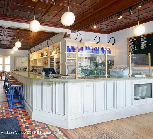 a view of a porch with wooden floor