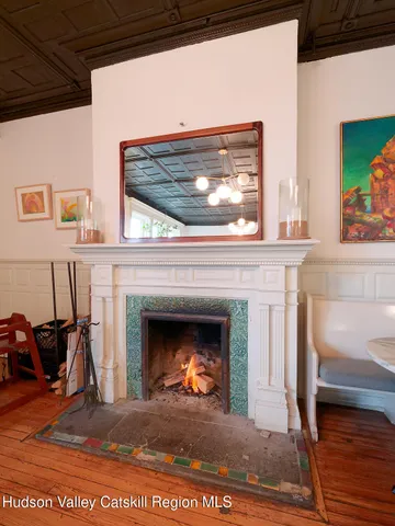 a view of fireplace and wooden floor