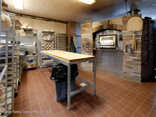 a view of a hallway with seating area