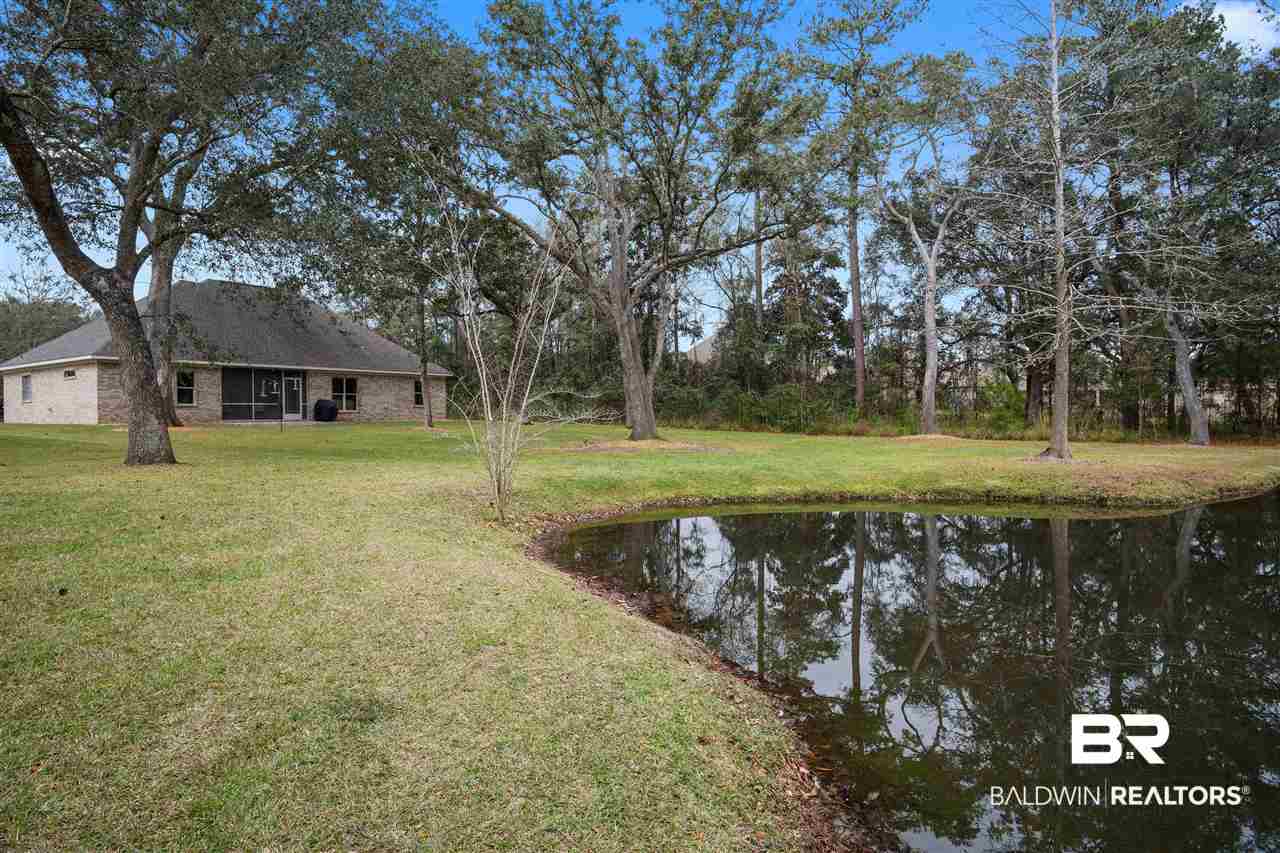 27554 Red Eagle Drive Daphne, AL 36526 - Photo 41 of 46 Sod to the pond with irrigation system