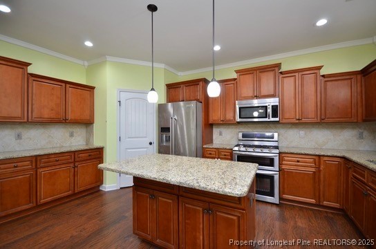 281 Ganton Drive Raeford, NC 28376 - Photo 15 of 50 a kitchen with stainless steel appliances granite countertop wooden cabinets a stove a sink and a wooden floors