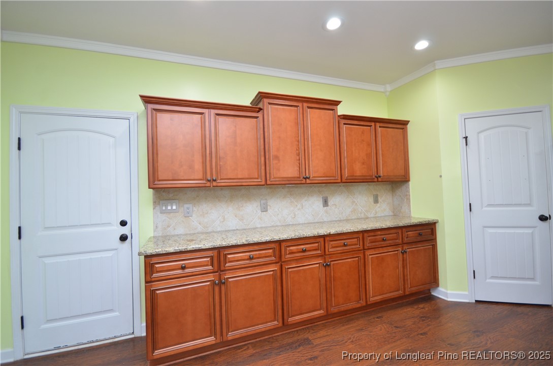 281 Ganton Drive Raeford, NC 28376 - Photo 18 of 50 a view of a kitchen with cabinets and wooden floor