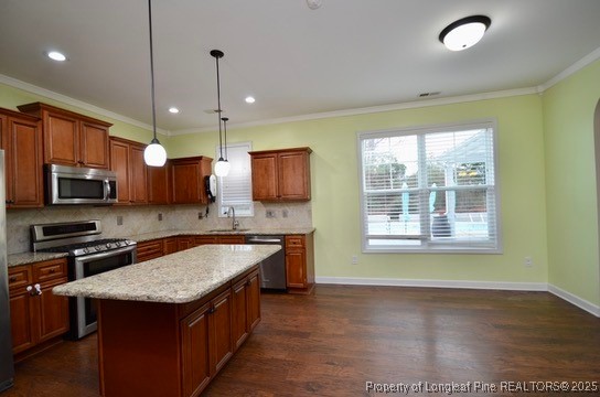 281 Ganton Drive Raeford, NC 28376 - Photo 19 of 50 a kitchen with stainless steel appliances granite countertop a sink a stove and a wooden floor