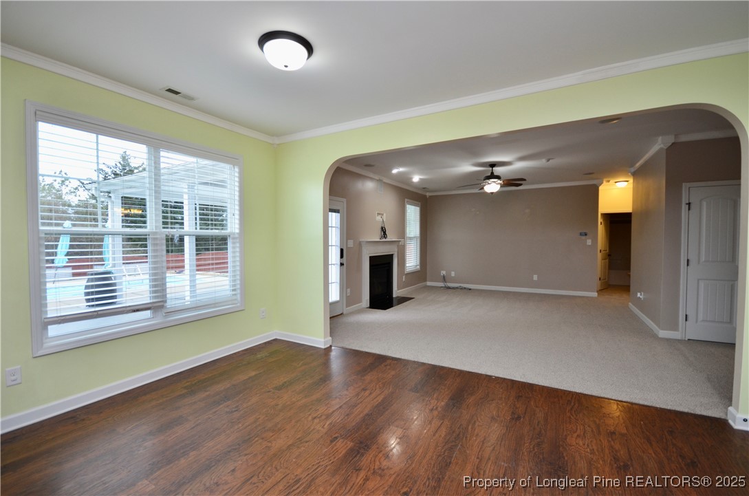 281 Ganton Drive Raeford, NC 28376 - Photo 21 of 50 a view of an empty room with wooden floor and a window