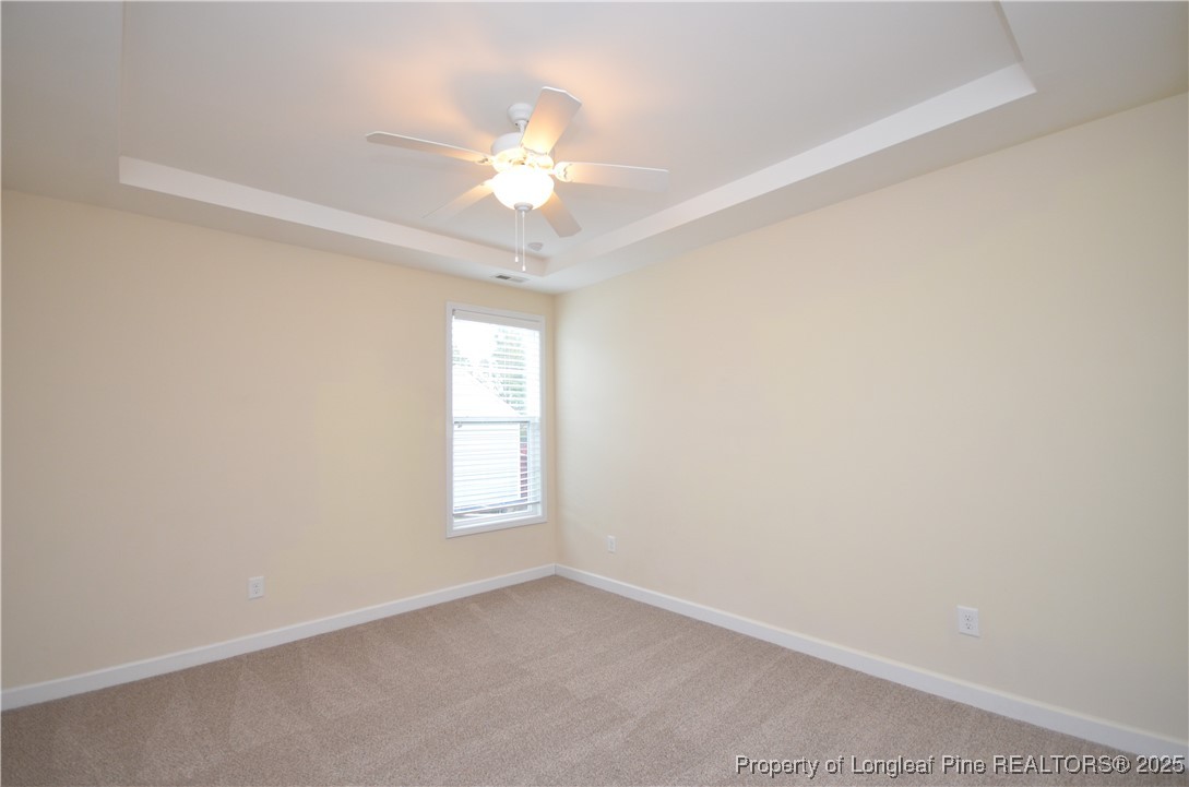 281 Ganton Drive Raeford, NC 28376 - Photo 23 of 50 an empty room with windows and fan