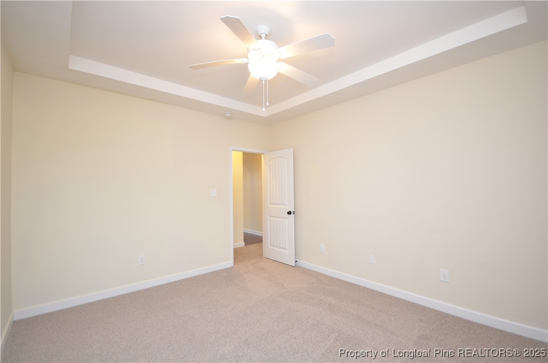 281 Ganton Drive Raeford, NC 28376 - Photo 24 of 50 an empty room with a ceiling fan and a window