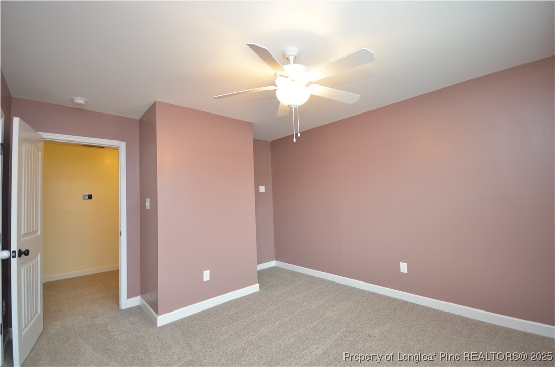 281 Ganton Drive Raeford, NC 28376 - Photo 32 of 50 an empty room with closet and a chandelier fan