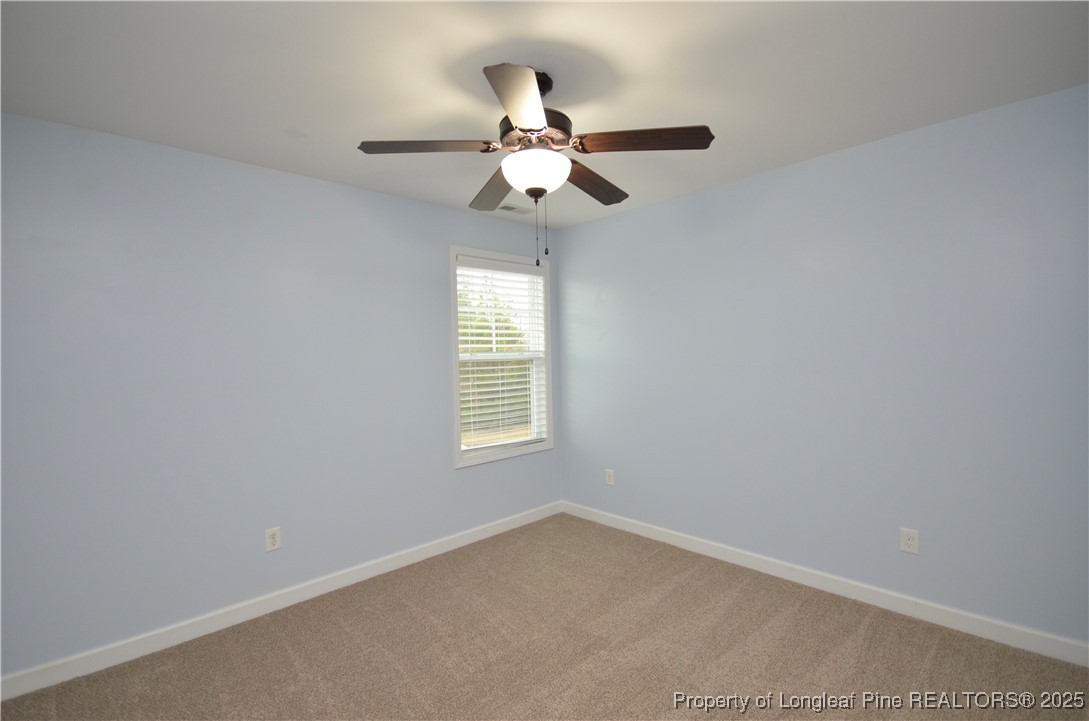 281 Ganton Drive Raeford, NC 28376 - Photo 33 of 50 an empty room with a window and a fan
