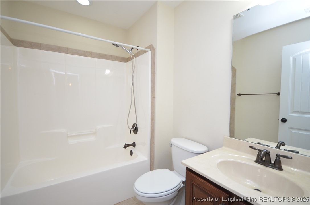281 Ganton Drive Raeford, NC 28376 - Photo 39 of 50 a bathroom with a sink toilet and shower
