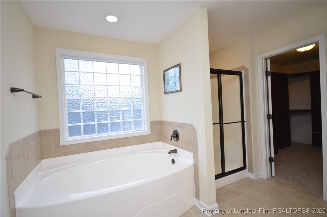 281 Ganton Drive Raeford, NC 28376 - Photo 44 of 50 a white bath tub sitting next to a window