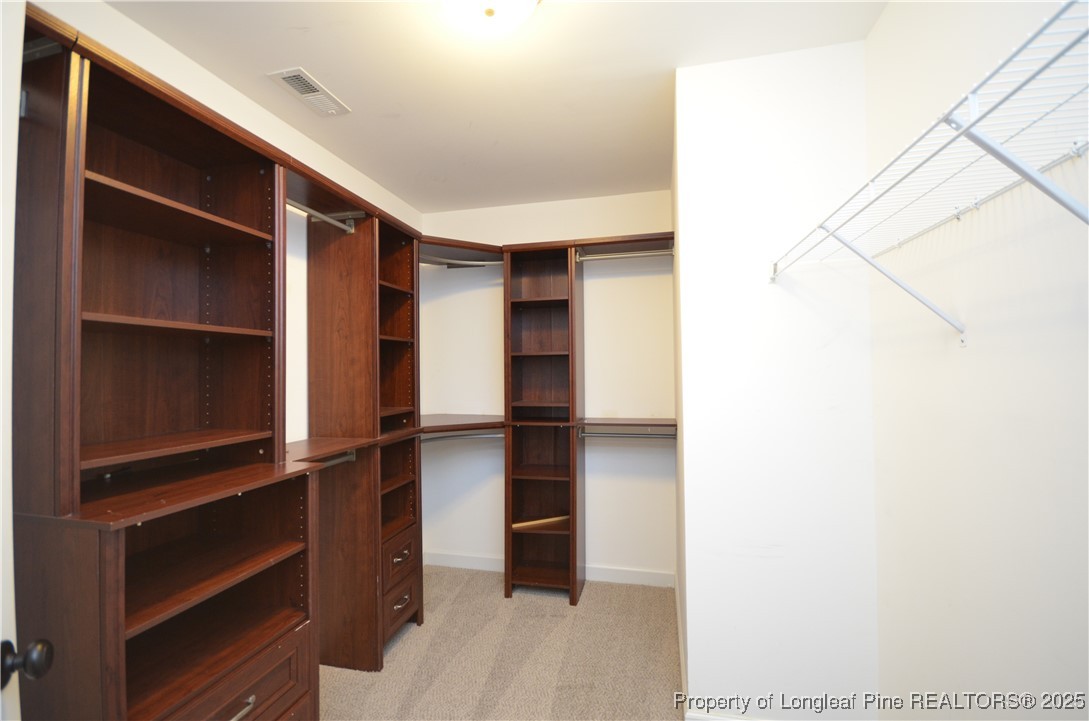281 Ganton Drive Raeford, NC 28376 - Photo 46 of 50 a view of walk in closet with empty racks