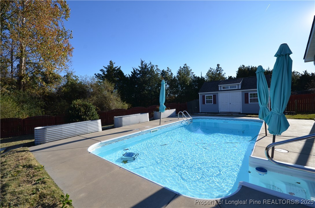 281 Ganton Drive Raeford, NC 28376 - Photo 49 of 50 a view of a swimming pool with an outdoor seating