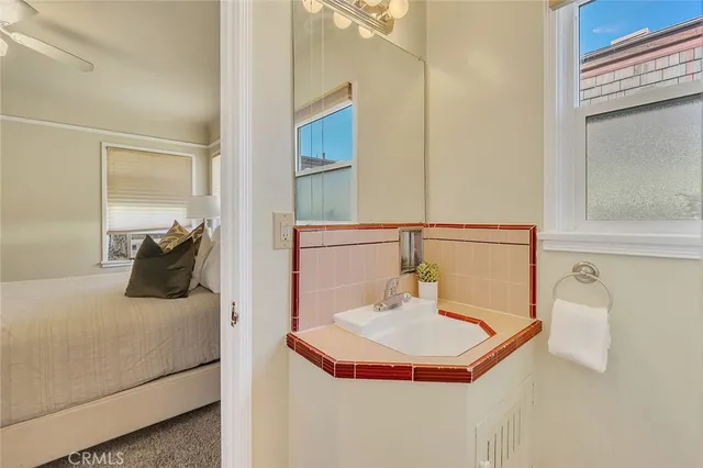 a bathroom with a sink and mirror