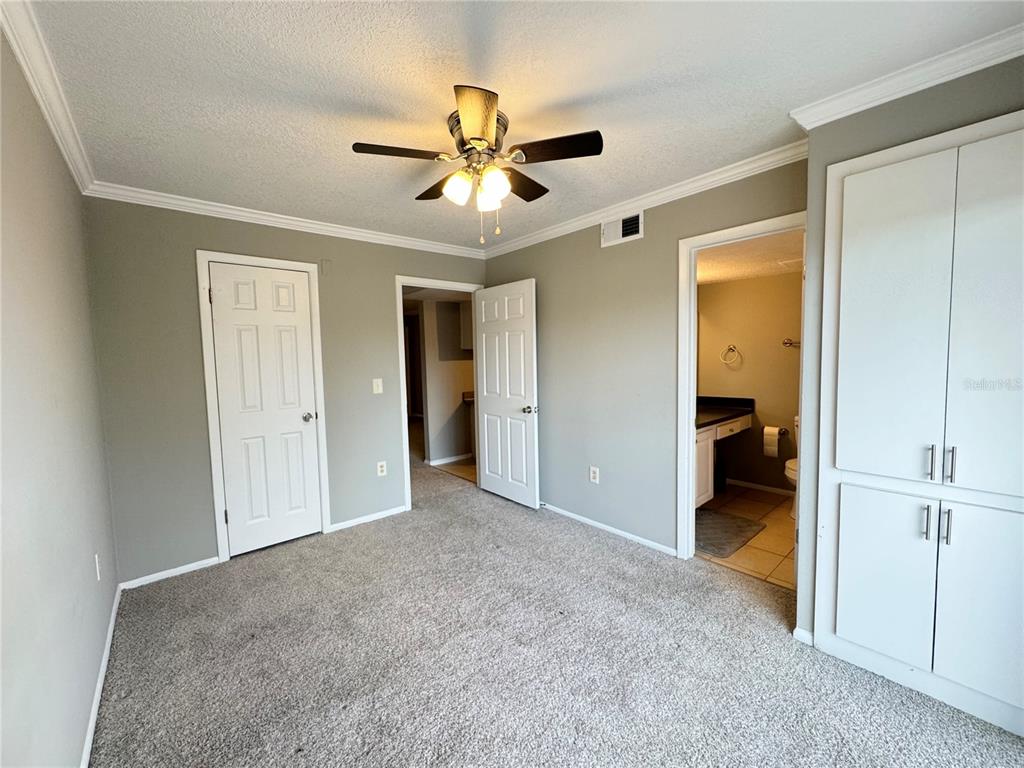 120 Blue Pointe Way, Unit 320 Altamonte Springs, FL 32701 - Photo 12 of 27 a view of a big room with closet and a ceiling fan