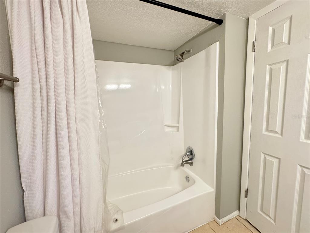 120 Blue Pointe Way, Unit 320 Altamonte Springs, FL 32701 - Photo 14 of 27 a bathroom with bathtub and shower