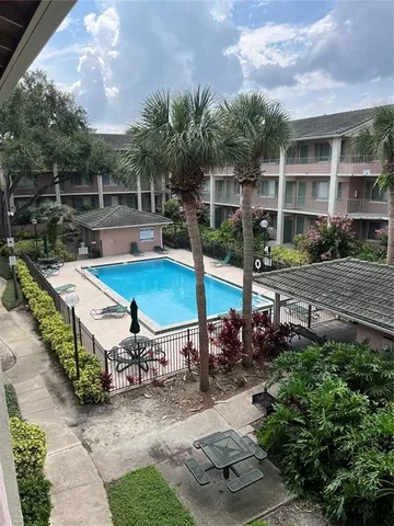 a view of a backyard with sitting area
