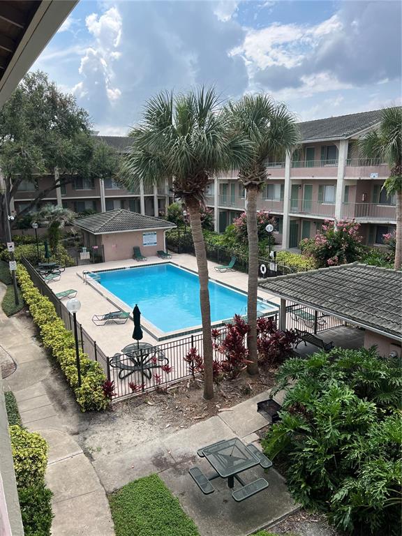120 Blue Pointe Way, Unit 320 Altamonte Springs, FL 32701 - Photo 22 of 27 a view of a backyard with sitting area