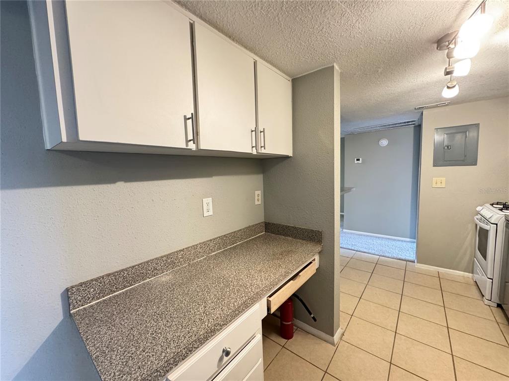 120 Blue Pointe Way, Unit 320 Altamonte Springs, FL 32701 - Photo 10 of 27 a kitchen with granite countertop a sink and a stove