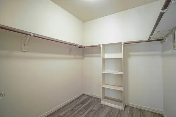 a view of an empty walk in closet