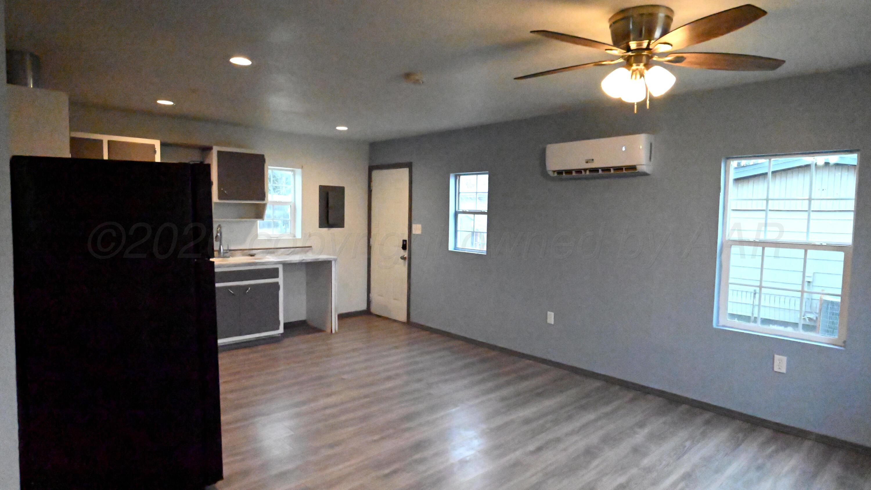 306 Union Street Borger, TX 79007 - Photo 2 of 12 a view of a kitchen with a sink and a refrigerator