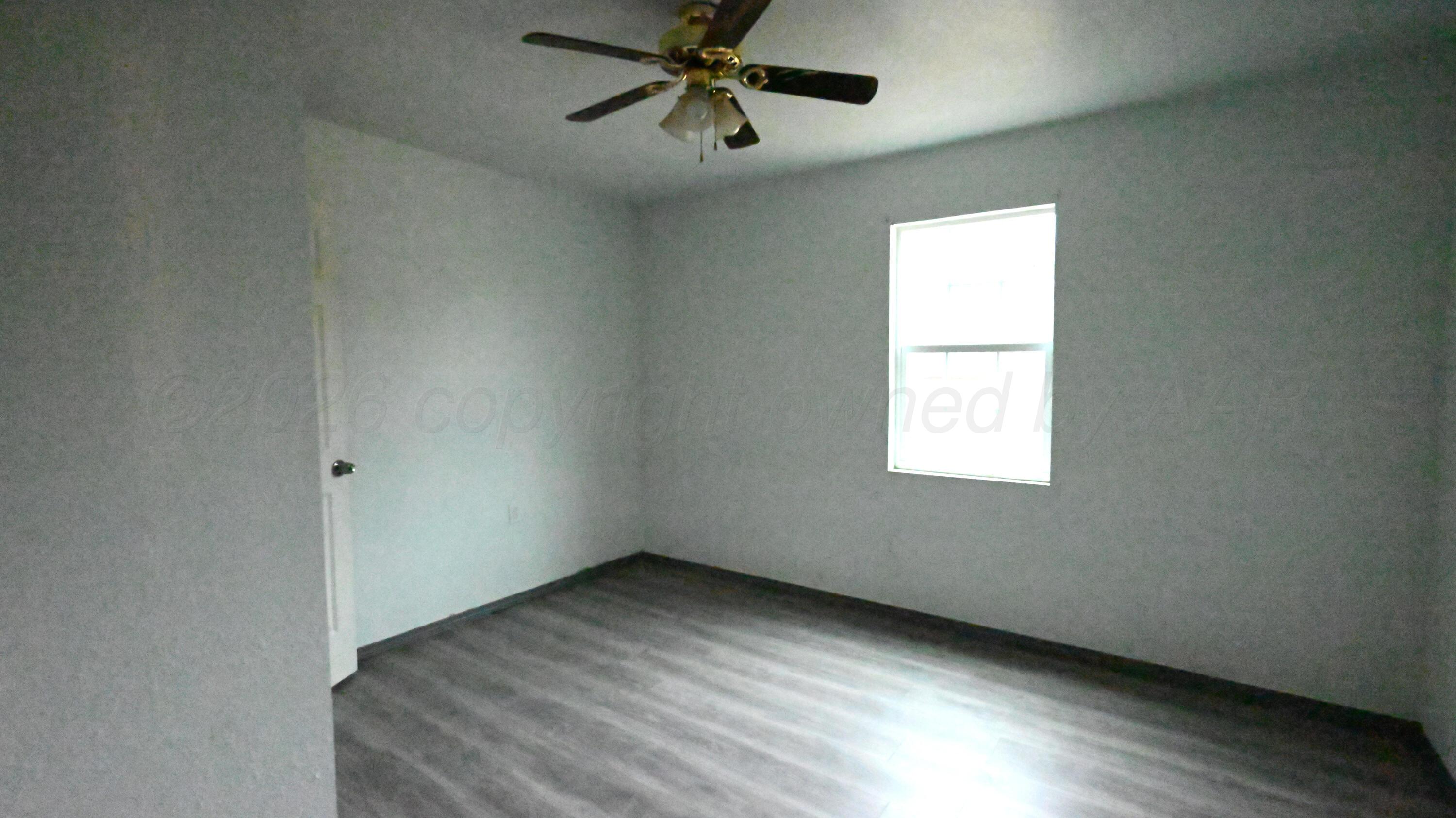 306 Union Street Borger, TX 79007 - Photo 8 of 12 a view of an empty room with a window