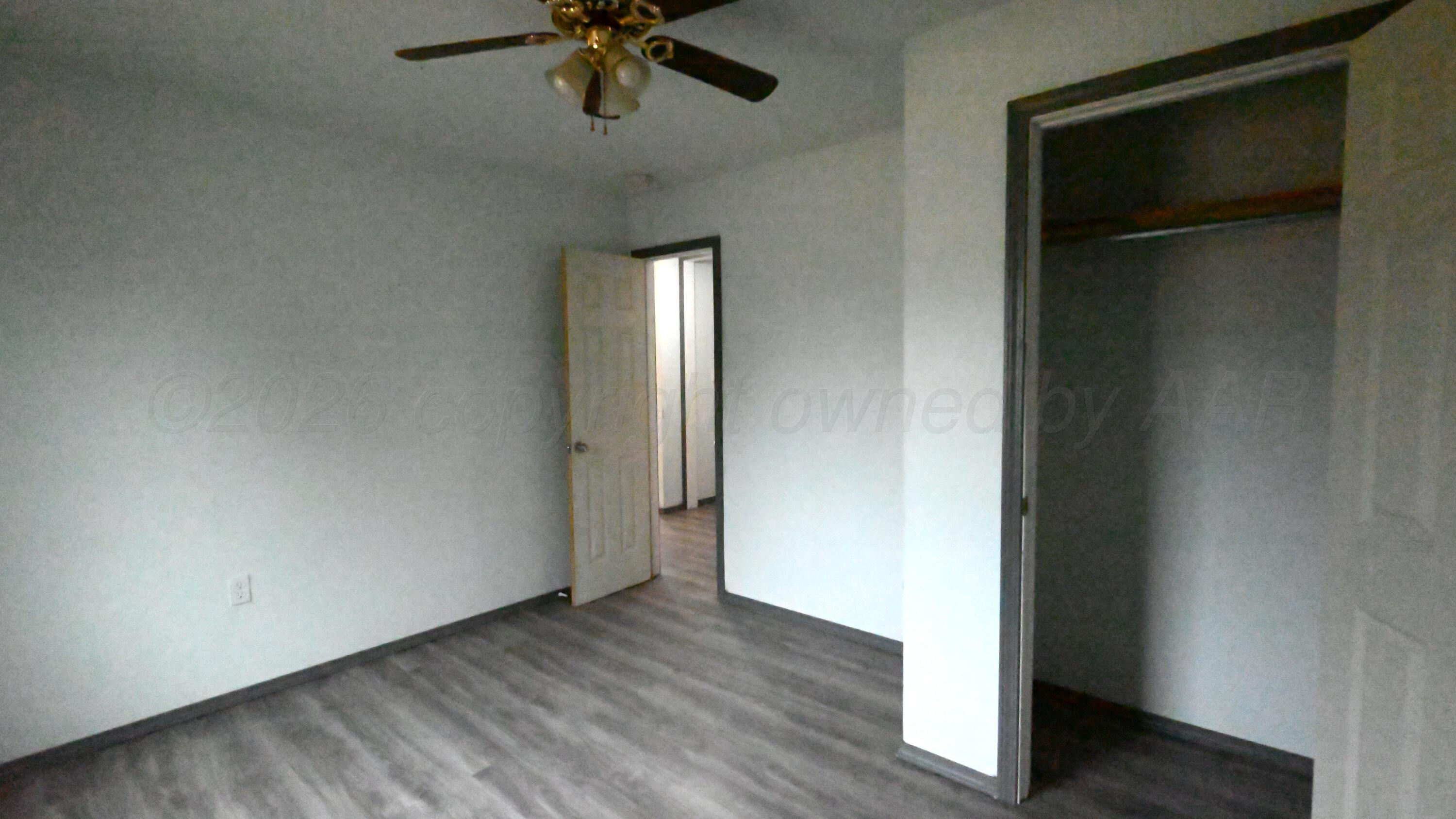306 Union Street Borger, TX 79007 - Photo 9 of 12 wooden floor in an empty room