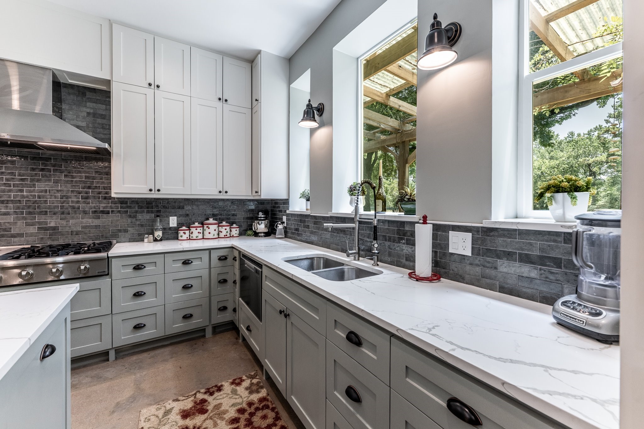 13334 Fultz Road Conroe, TX 77304 - Photo 5 of 49 From morning coffee to sunset views, this window-lined kitchen brings the beauty of the outdoors right to your sink.