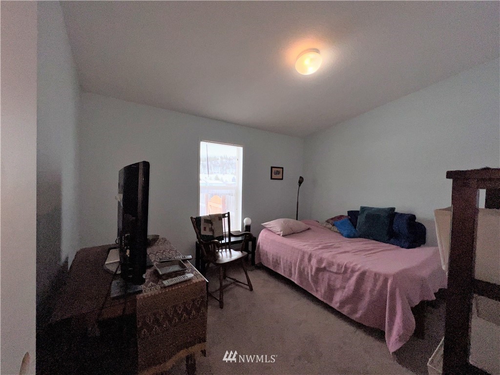 58 Heron Loop Road Republic, WA 99166 - Photo 16 of 30 a bedroom with a bed and furniture