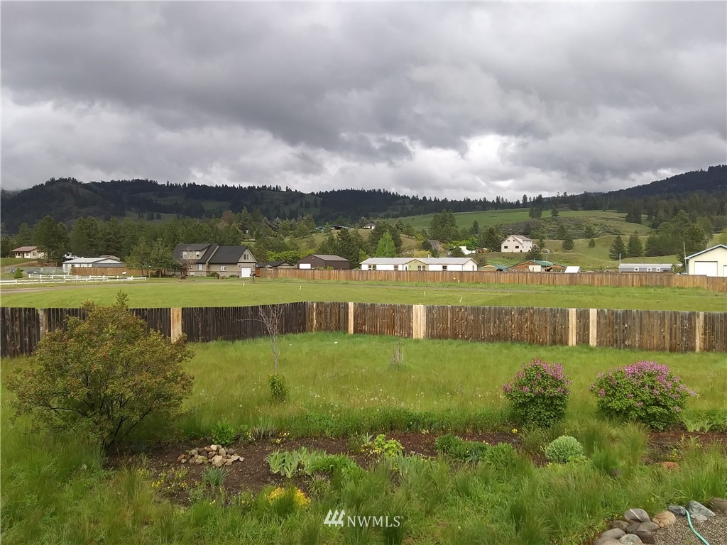 58 Heron Loop Road Republic, WA 99166 - Photo 18 of 30 a view of a lake with houses in the back