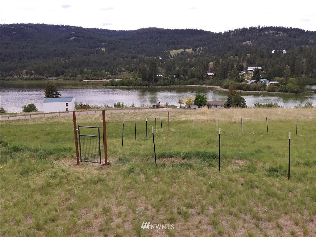 58 Heron Loop Road Republic, WA 99166 - Photo 21 of 30 a view of a lake with a mountain in the background