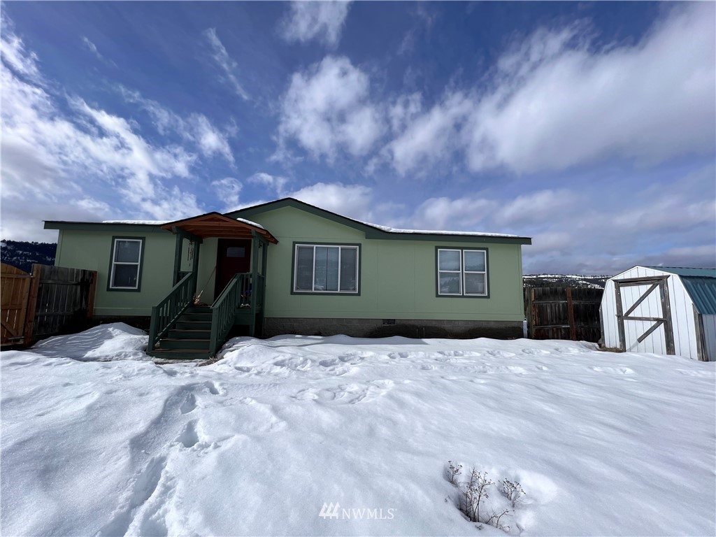 58 Heron Loop Road Republic, WA 99166 - Photo 30 of 30 a front view of a house with a yard