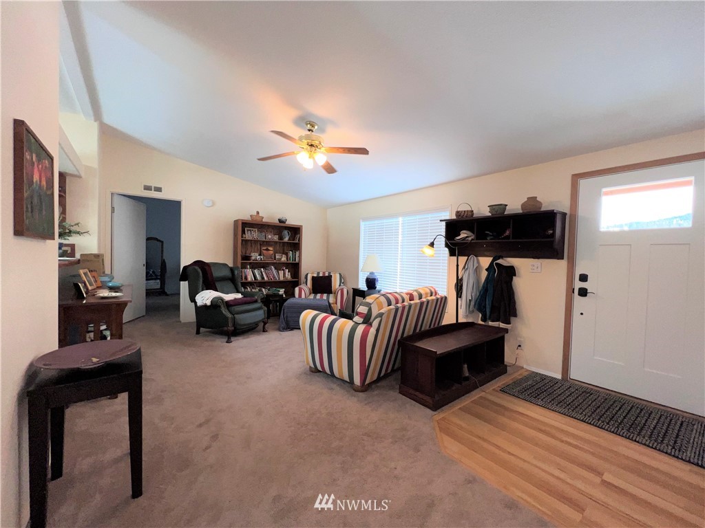 58 Heron Loop Road Republic, WA 99166 - Photo 4 of 30 a living room with furniture and a flat screen tv