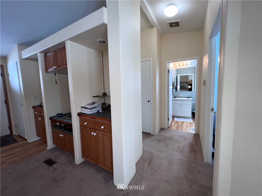 58 Heron Loop Road Republic, WA 99166 - Photo 9 of 30 a view of a hallway and a livingroom with furniture