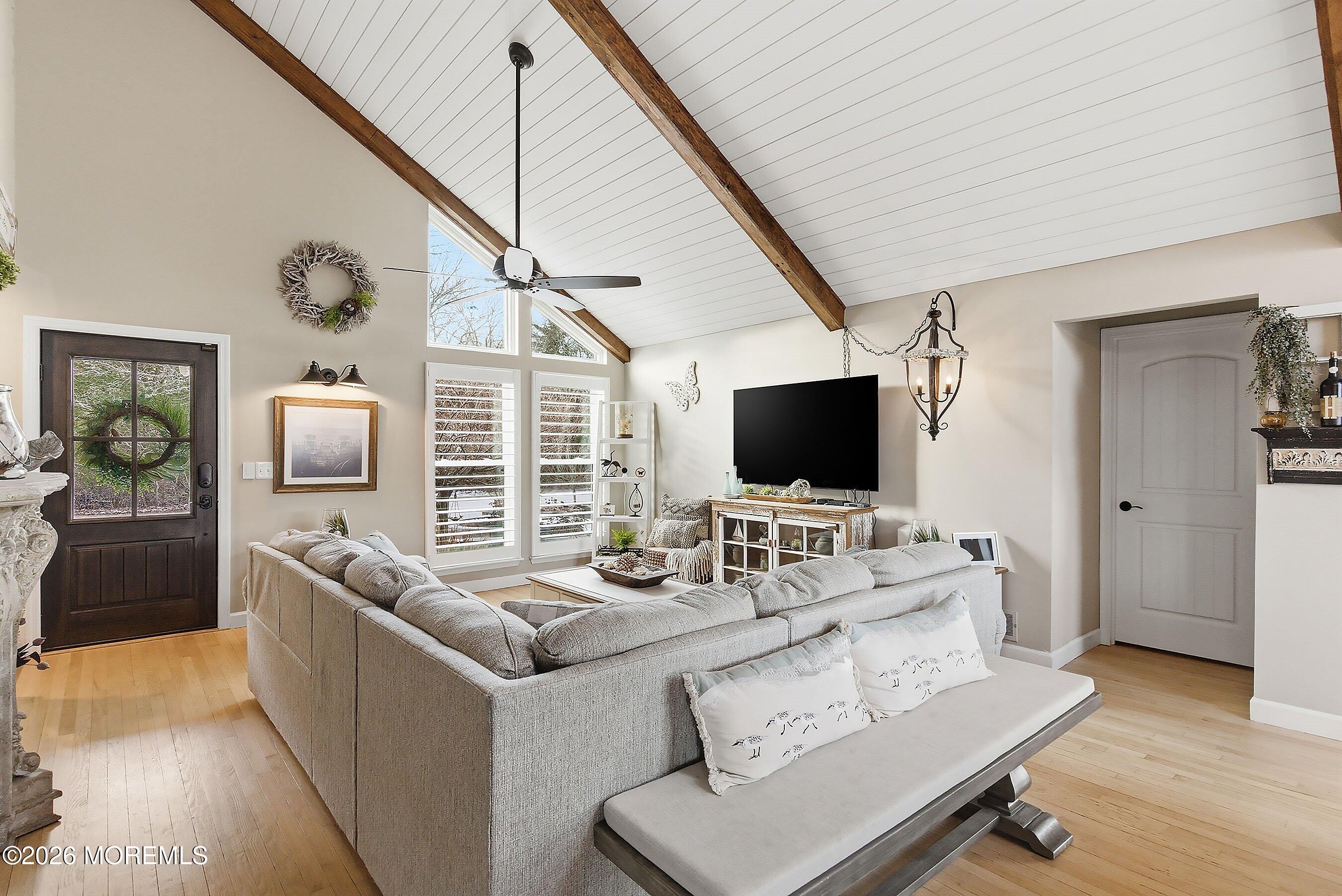 261 Timberlake Drive Manahawkin, NJ 08050 - Photo 11 of 64 a living room with furniture and a flat screen tv