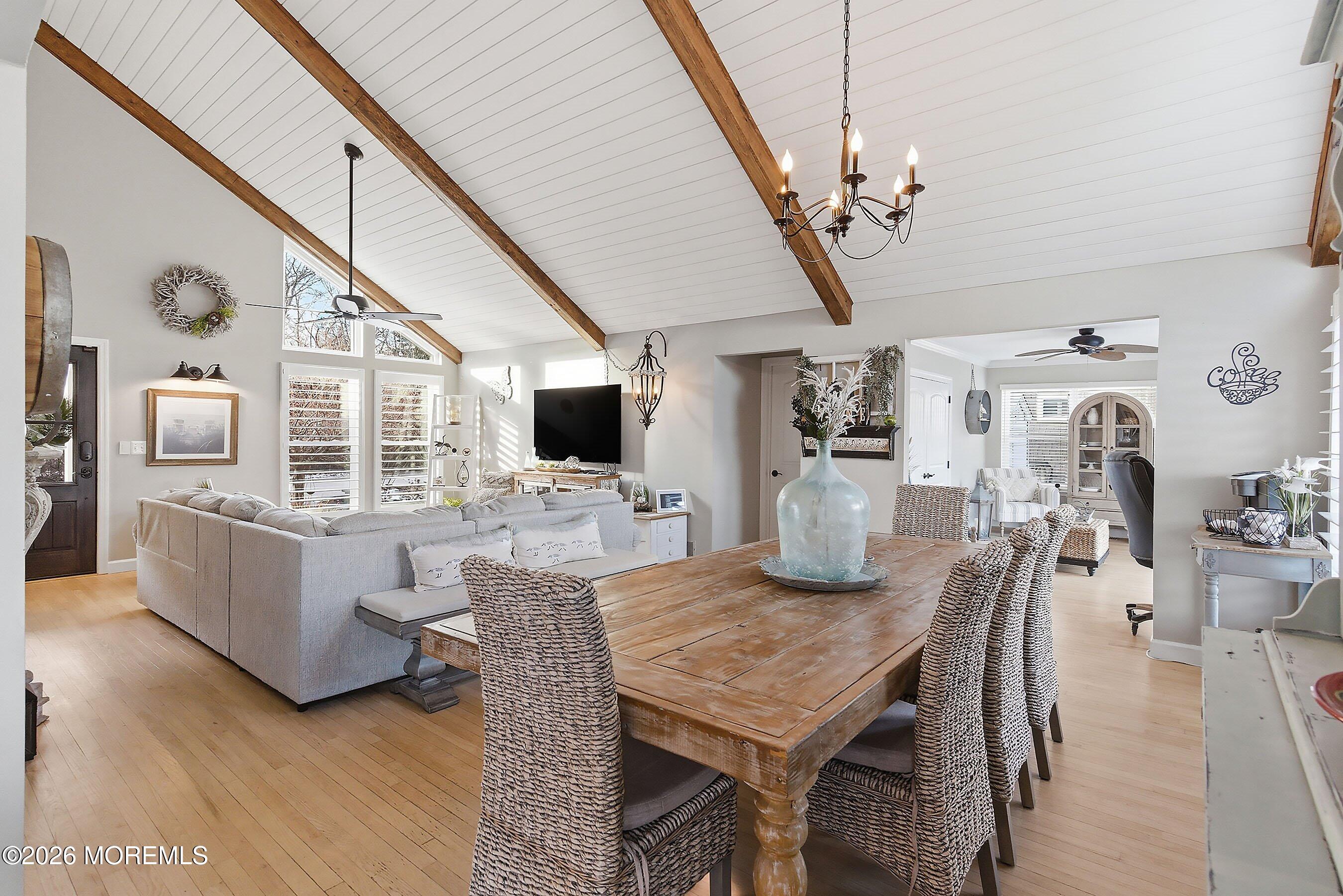 261 Timberlake Drive Manahawkin, NJ 08050 - Photo 13 of 64 a view of a dining room with furniture a chandelier and wooden floor